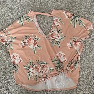 Pink floral tie shirt.